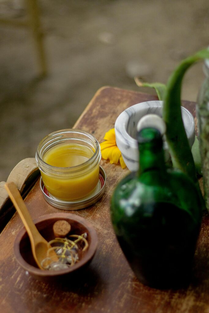 Natural herbal remedy preparation with healing balm, organic ingredients, and essential oils – Anupama Wellness | Holistic health products UK.jpg